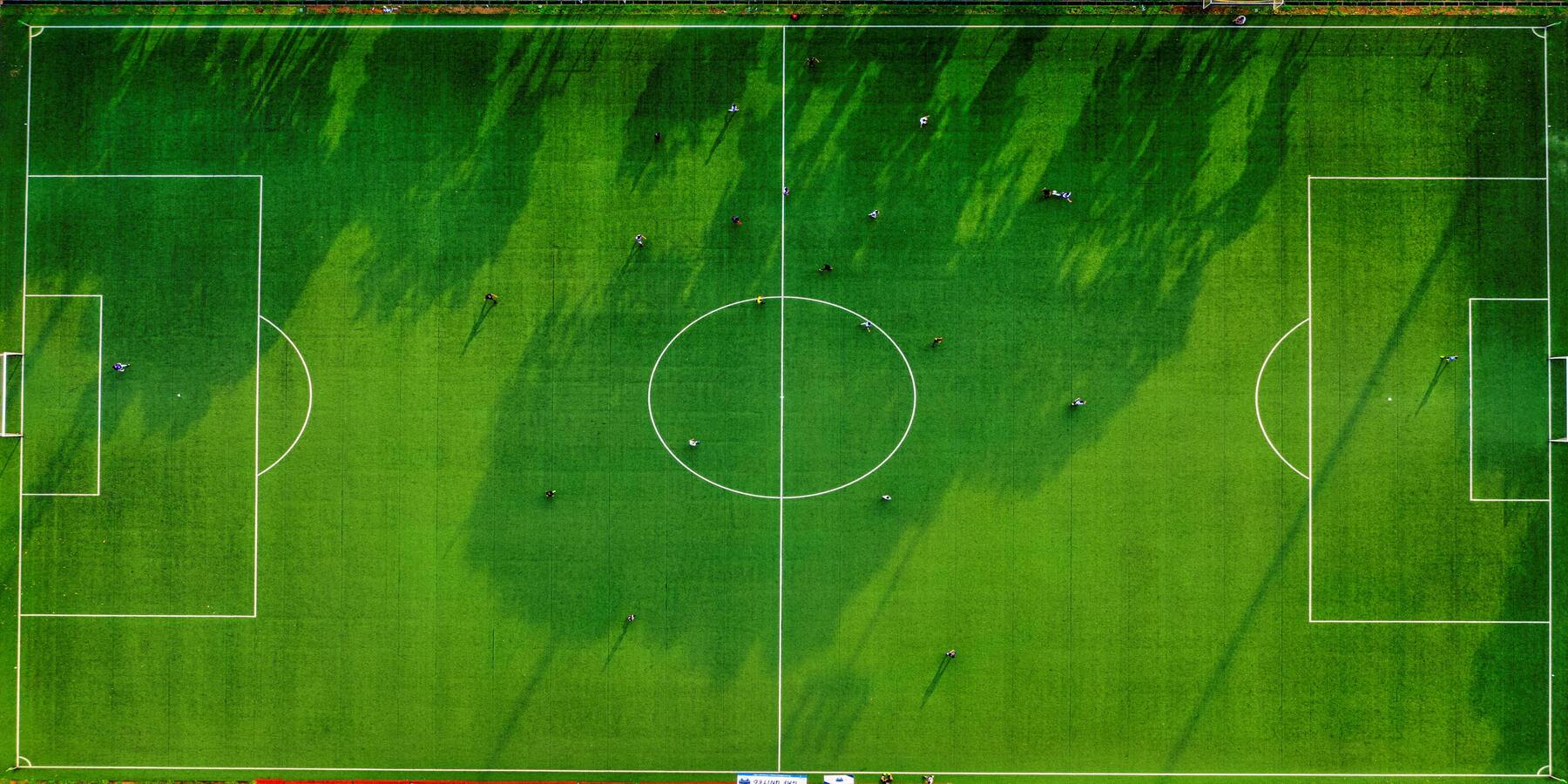 Aerial view of a football pitch illustrating match-week structure