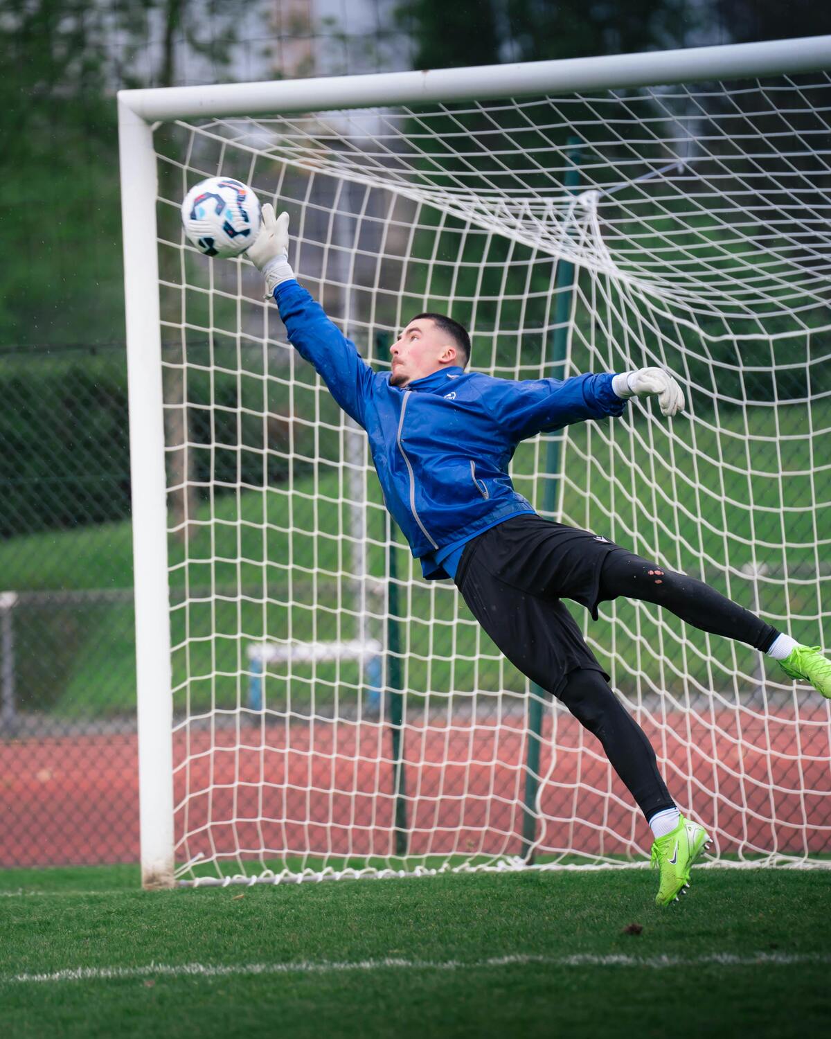 Goalkeeper saving a shot during a football match
